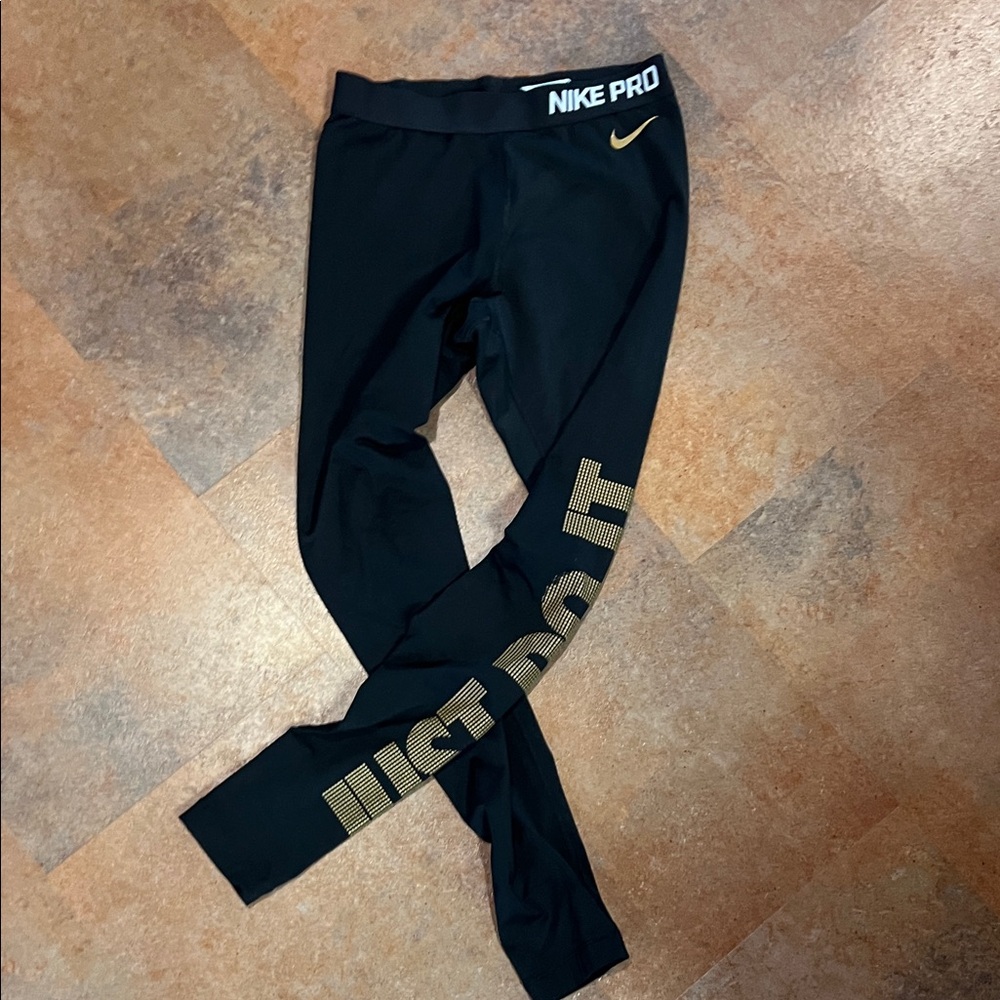 Nike women’s  Black and Gold Leggings